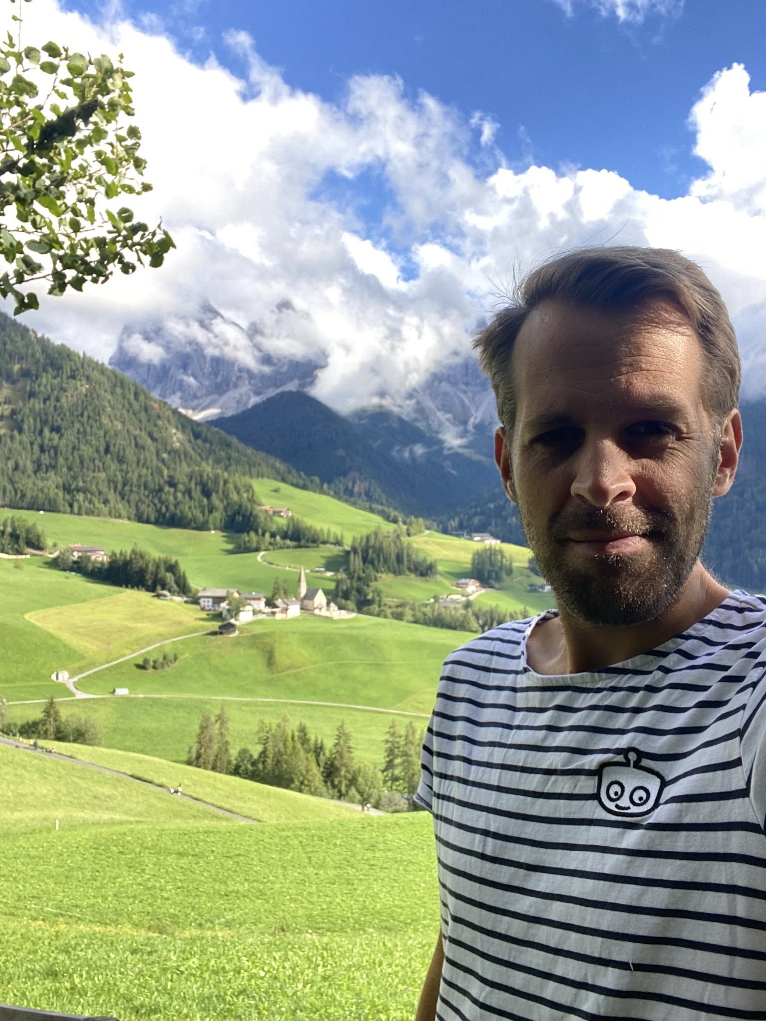 Mikael in the mountains with his sailor's outfit on.